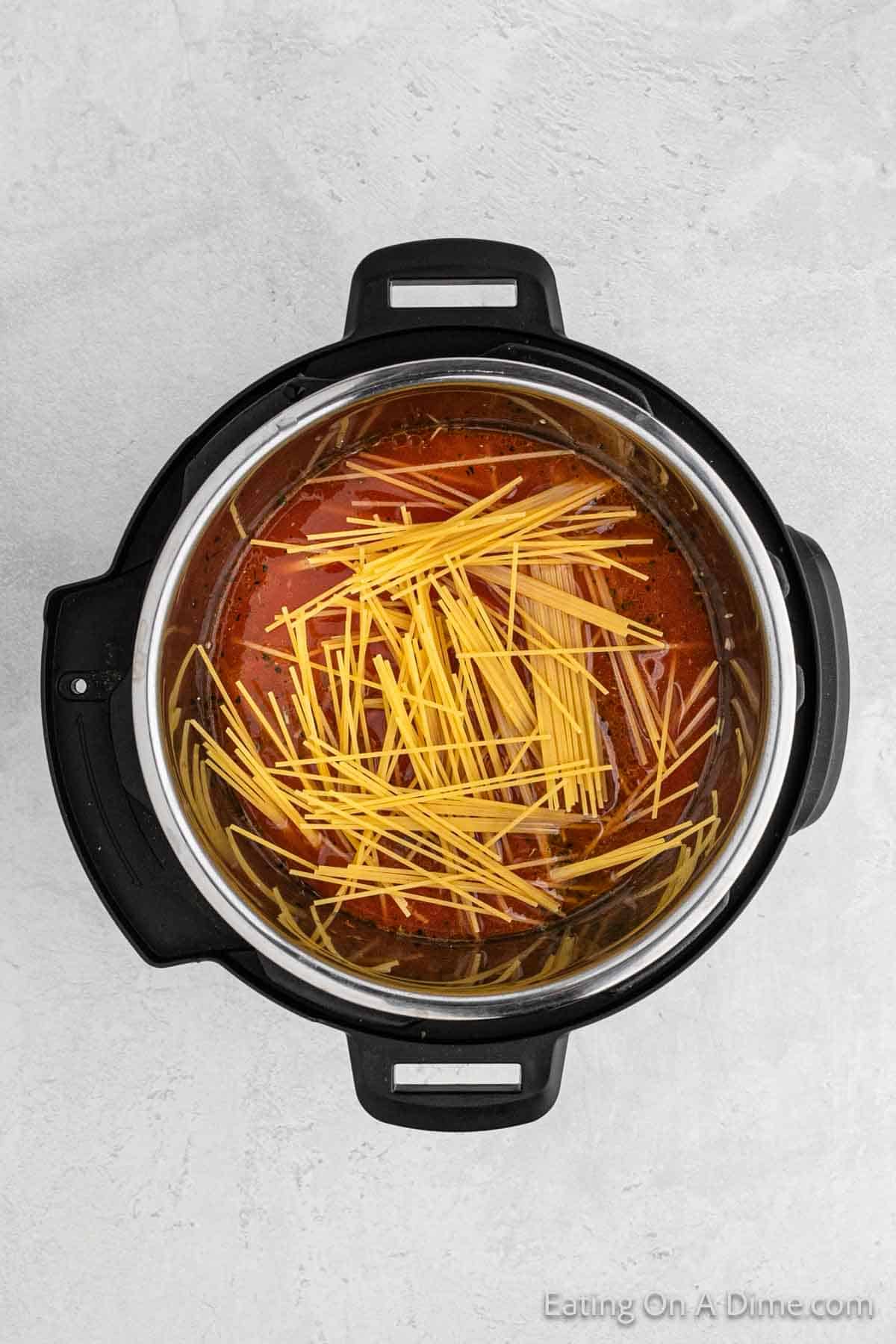 Add in the spaghetti noodles into the instant pot