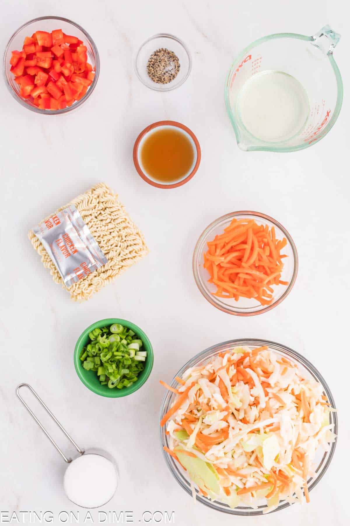 Ingredients needed for Ramen Noodle Salad - Coleslaw Mix, carrots, red pepper, green onions, ramen noodles, oil, apple cider vinegar, sugar, ramen chicken seasoning packet, black pepper, soy sauce