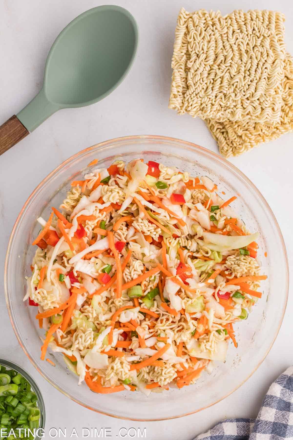 Combined oil dressing and salad ingredients together in a bowl