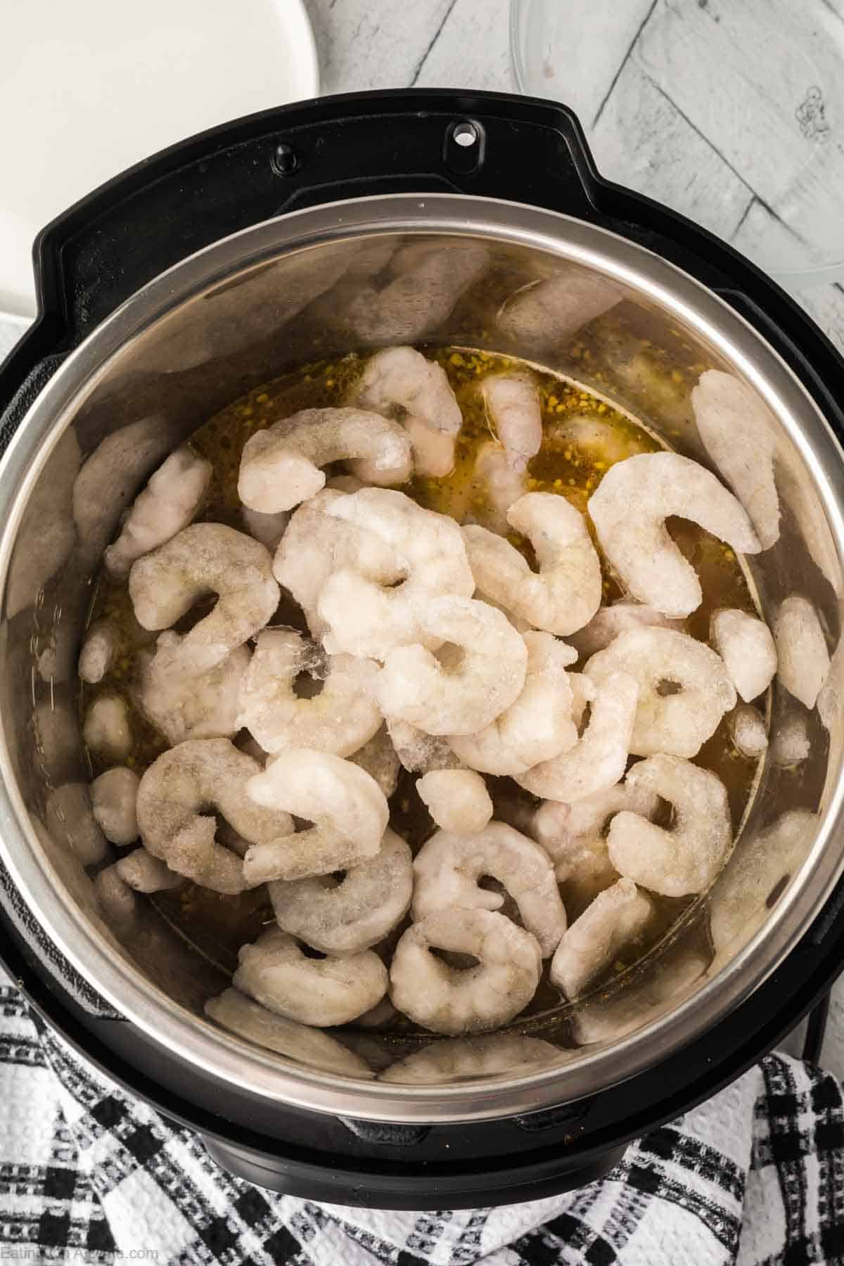 Adding in the shrimp to the instant pot
