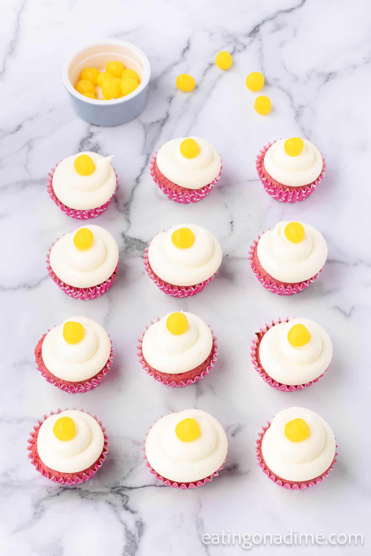 Top the frosted cupcakes with lemon candy