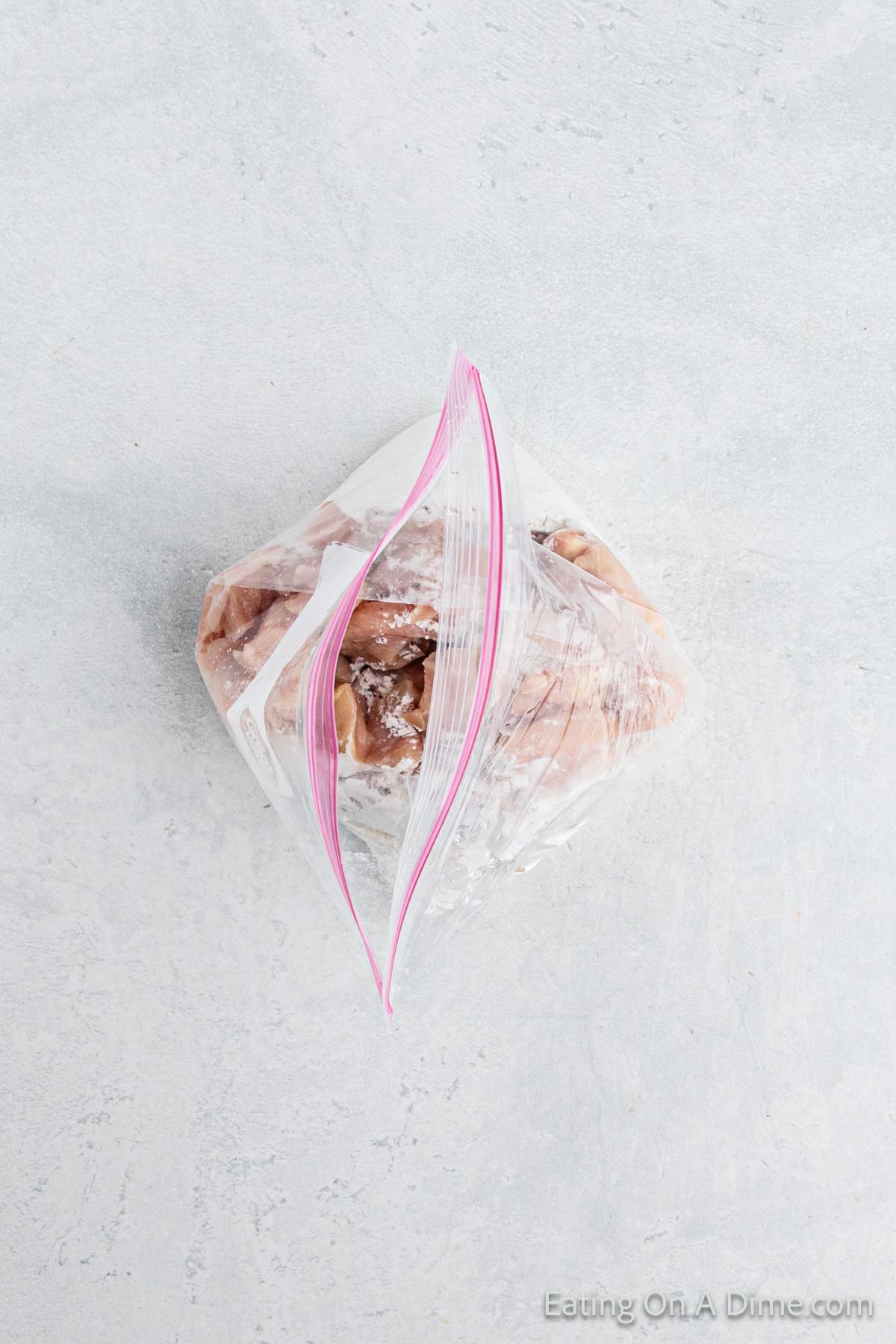 Diced chicken placed in a ziplock bag and added flour to coat chicken