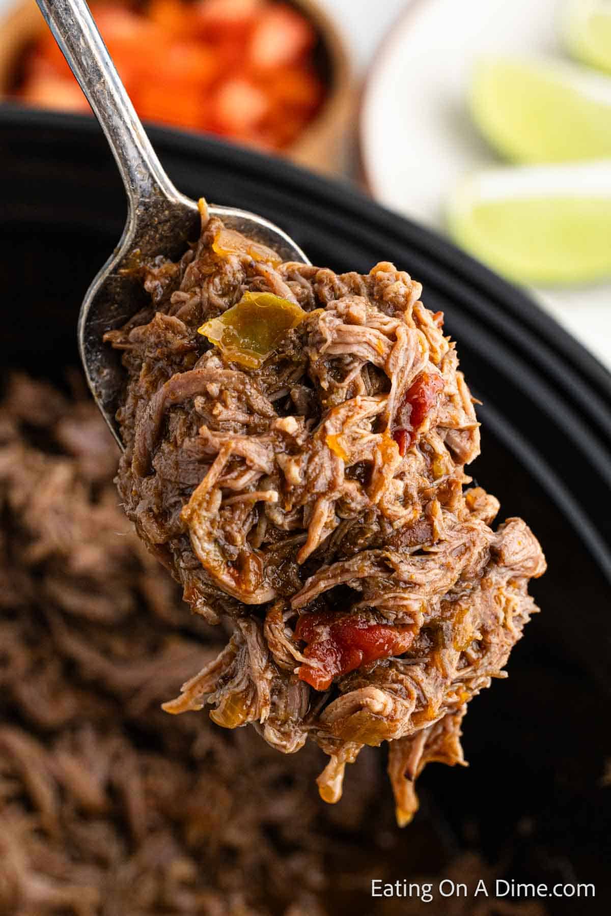 Close up image of shredded beef on a spoon