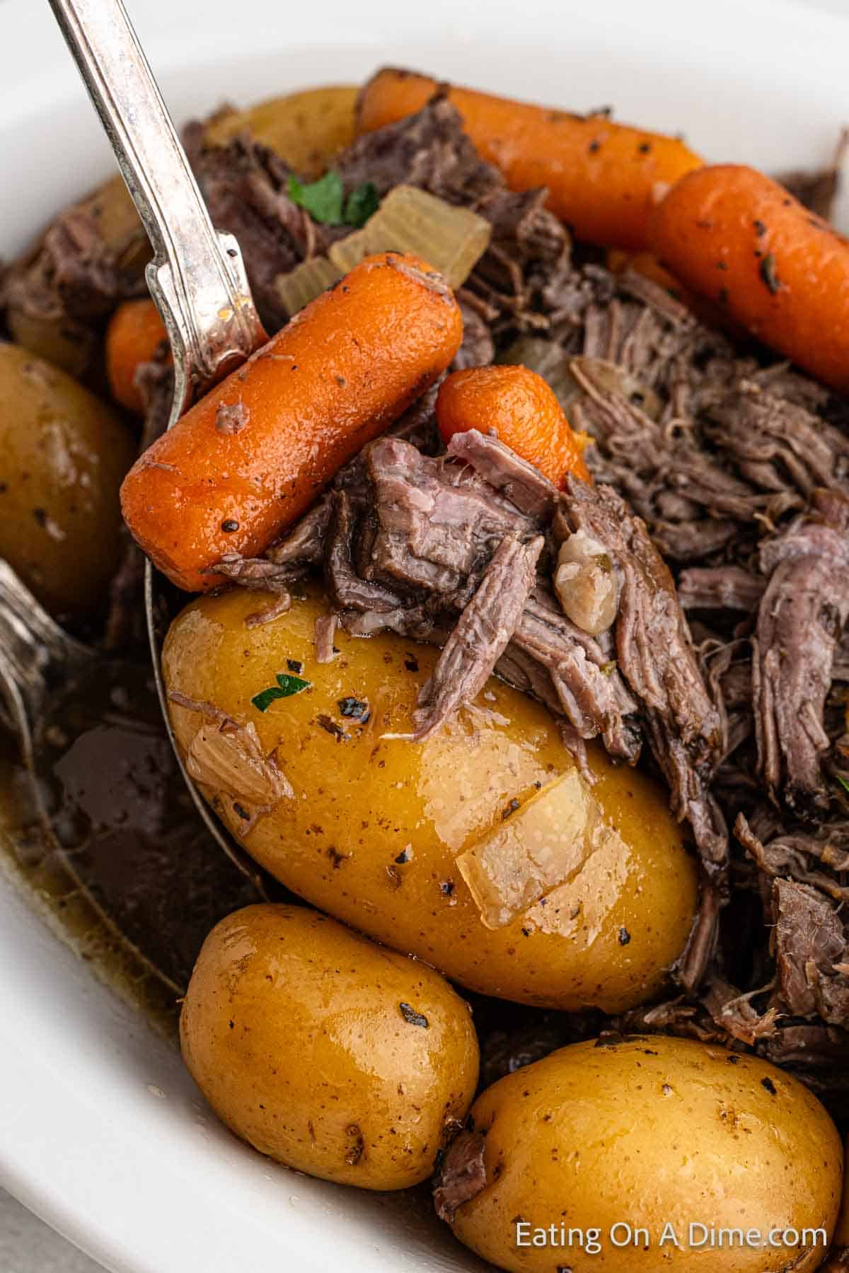 Close up image of pot roast with potatoes and carrots