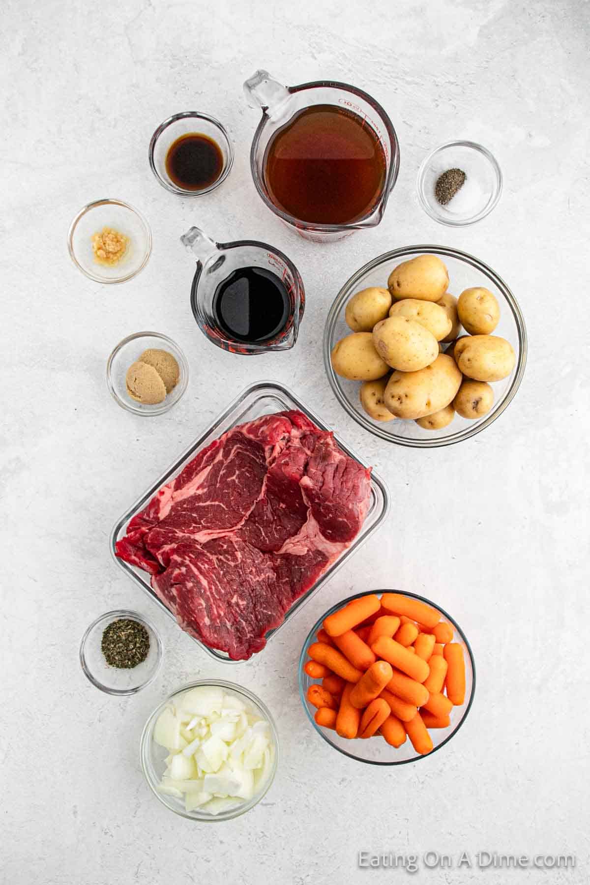 Balsamic Pot Roast ingredients - pot roast, onion, beef broth, balsamic vinegar, brown sugar, worcestershire sauce, carrots, potatoes, minced garlic, italian seasoning, salt and pepper