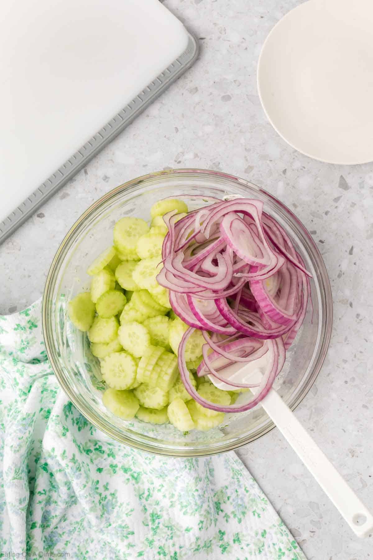 Placing onions and cucumbers in a bowl