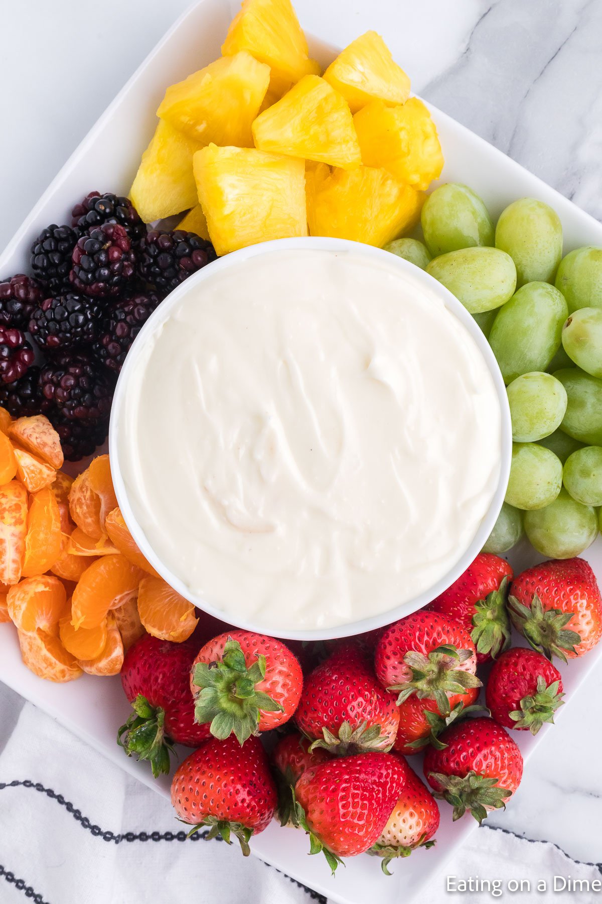 Bowl of Fruit Dip on a tray with fruit