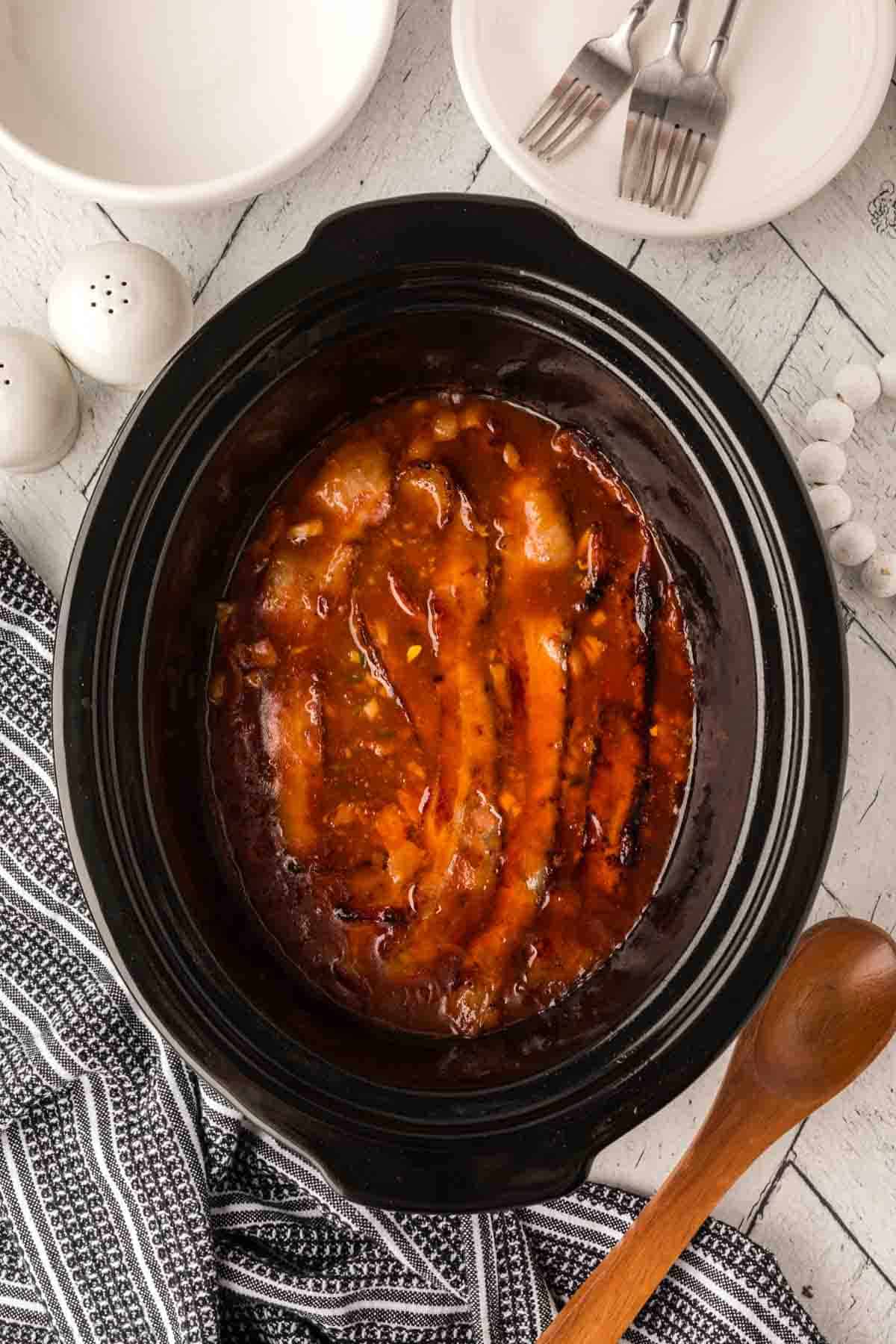 Cooked pork and beans in the slow cooker