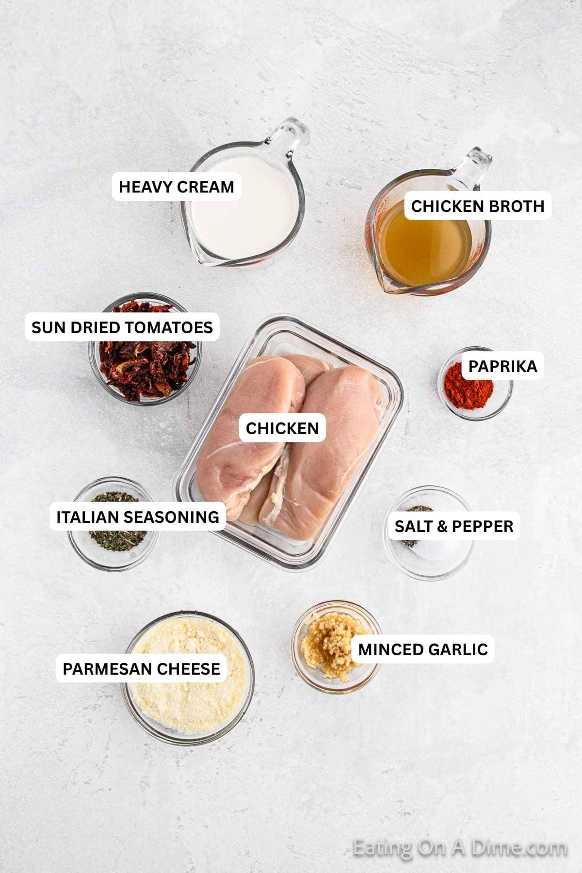 Ingredients for recipe: heavy cream, chicken broth, paprika, sun dried tomatoes, chicken, Italian seasoning, minced garlic, salt, pepper and Parmesan cheese. 