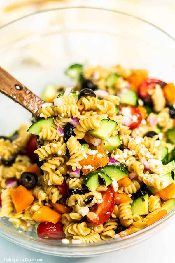 Greek Pasta Salad Recipe is so easy and frugal to prepare. Tons of veggies and pasta with the best flavor make this pasta salad recipe a family favorite. 