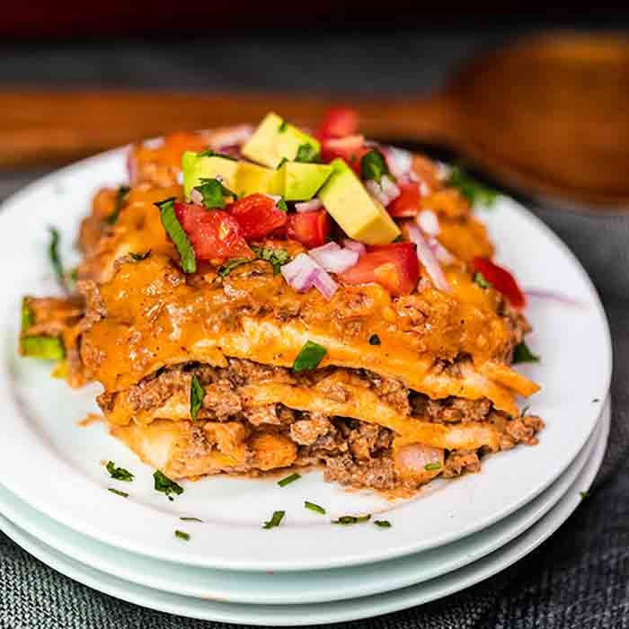 Enjoy Taco Lasagna Recipe any night of the week for dinner full of cheesy and delicious layers. Lots of ground beef, salsa and more blend for a great meal.