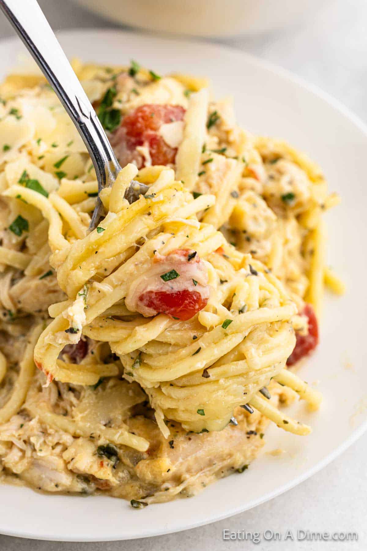 Chicken Spaghetti rolled up on a fork ready to eat