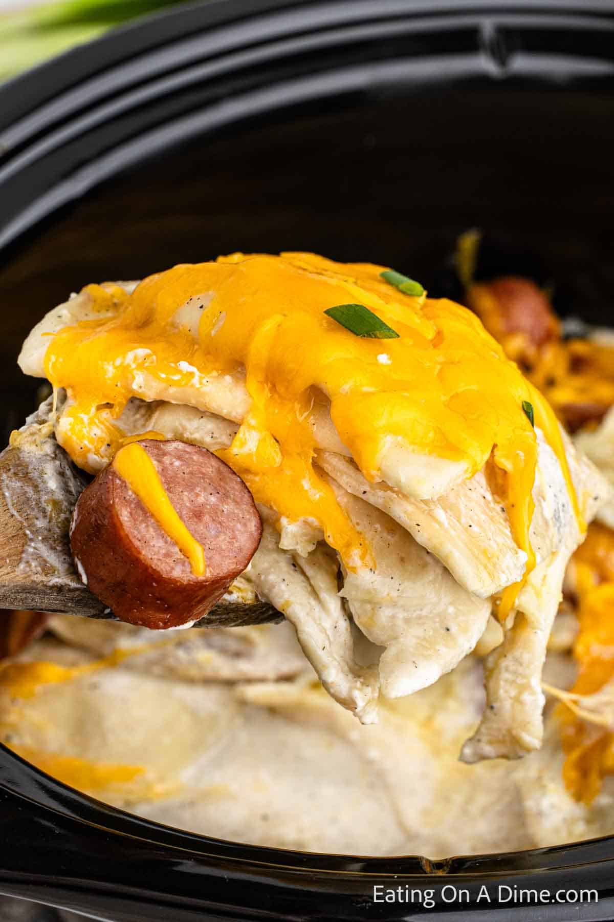 Close up image of pierogi casserole on a wooden spoon