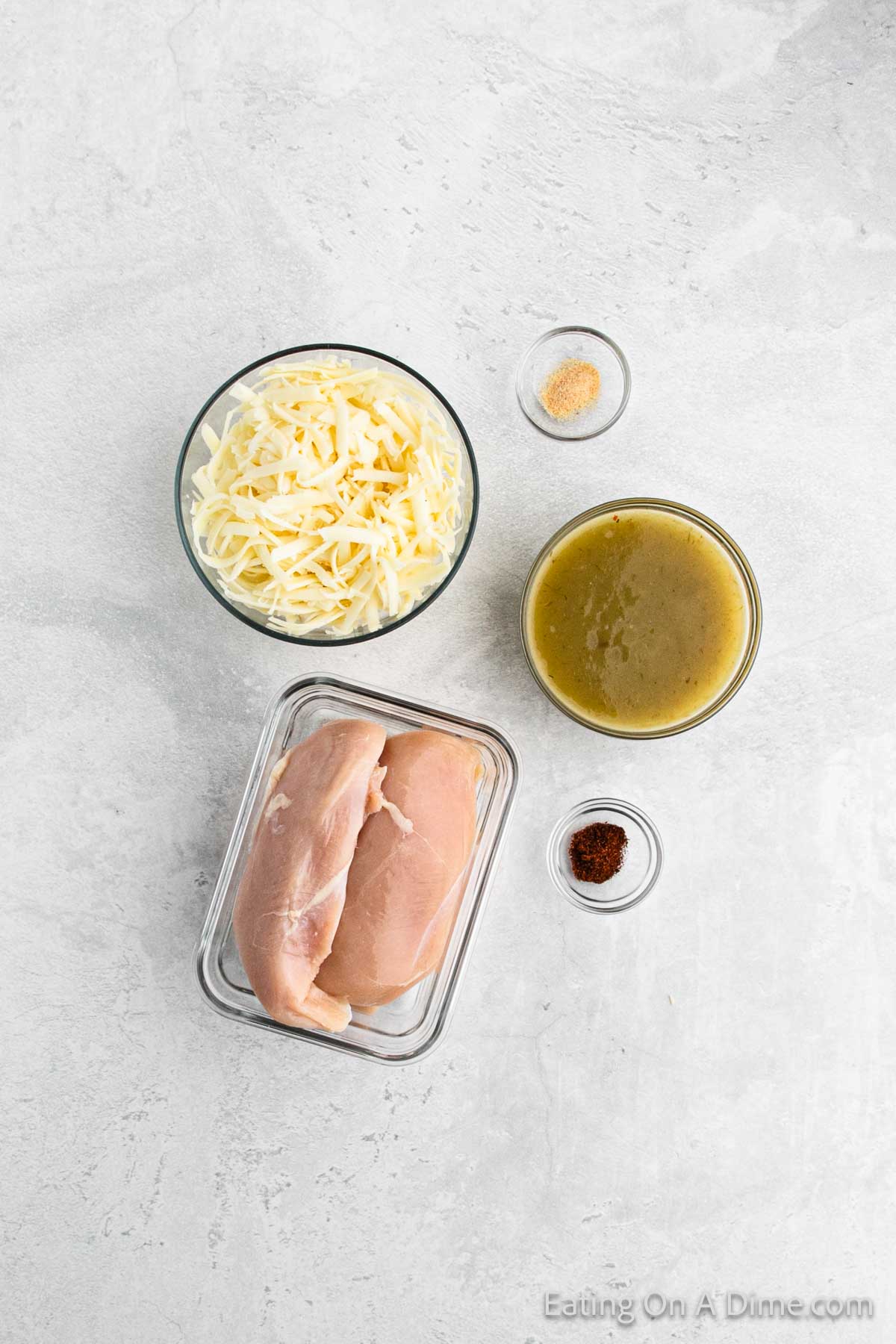 Ingredients - Chicken breast, shredded cheese, enchilada sauce, garlic salt, and chili powder