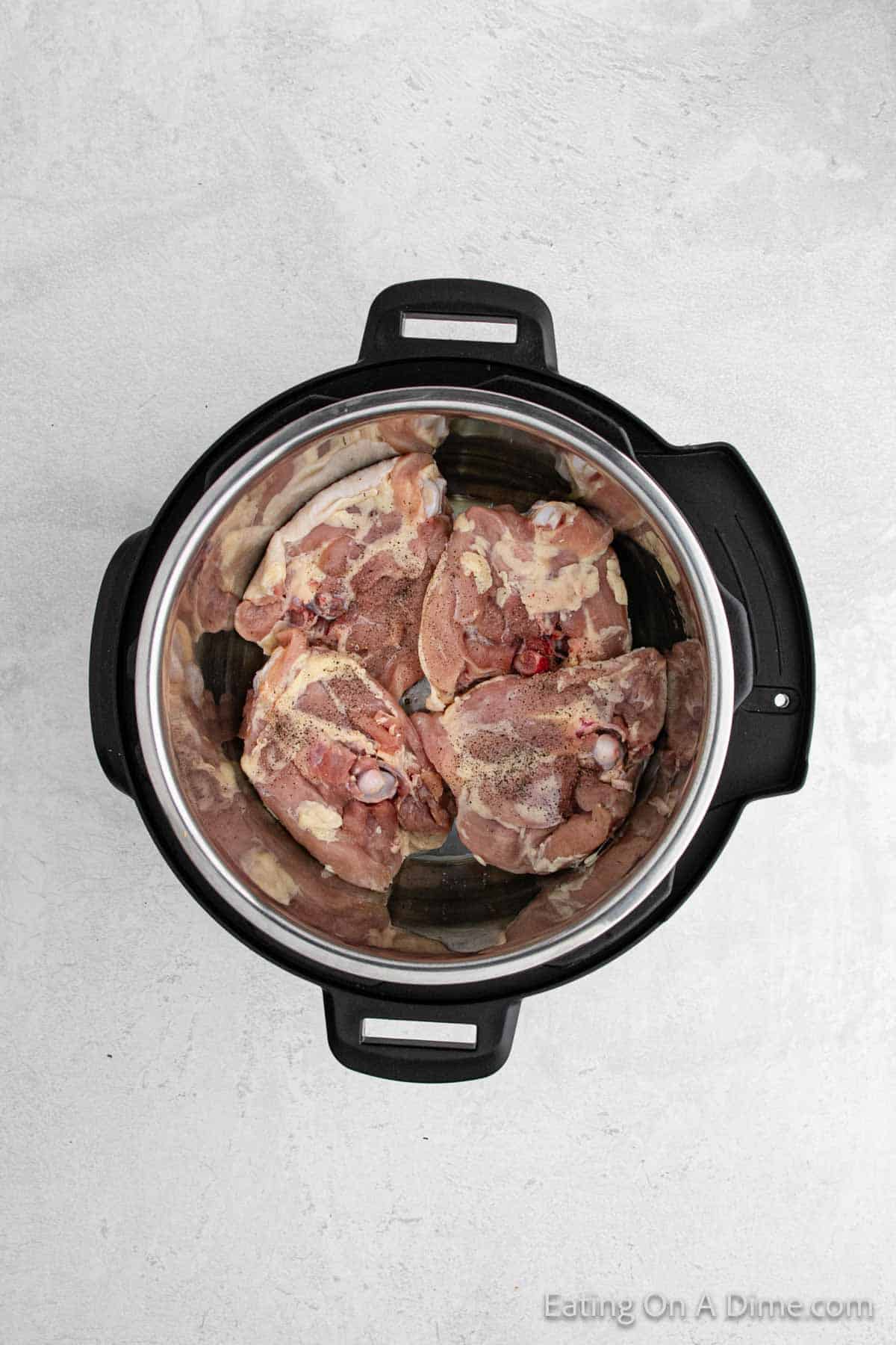Placing chicken thighs in the instant pot