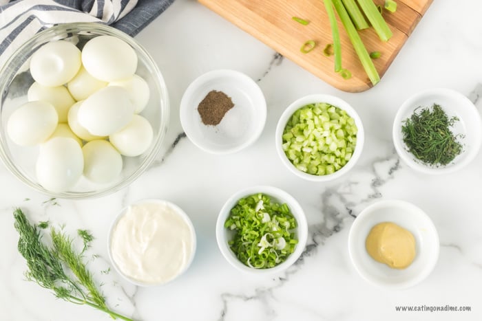 Egg salad Ingredients - Hard Boiled Eggs, Mayonnaise, Dijon Mustard, Green Onion, Celery, Fresh Dill, Salt and Pepper