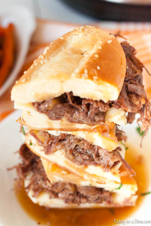 Instant pot french dip sandwiches are super easy in the pressure cooker and take only minutes. The beef is so tender and our family goes crazy over instant pot french dip sandwiches with french onion soup. Try the best instant pot french dip sandwiches easy recipe today. #eatingonadime #instantpotfrenchdipsandwiches