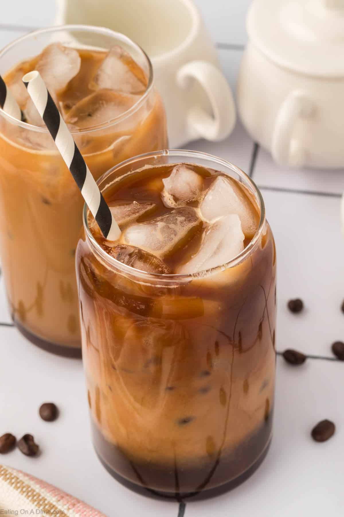 Ice coffee in a clear glass with a straw