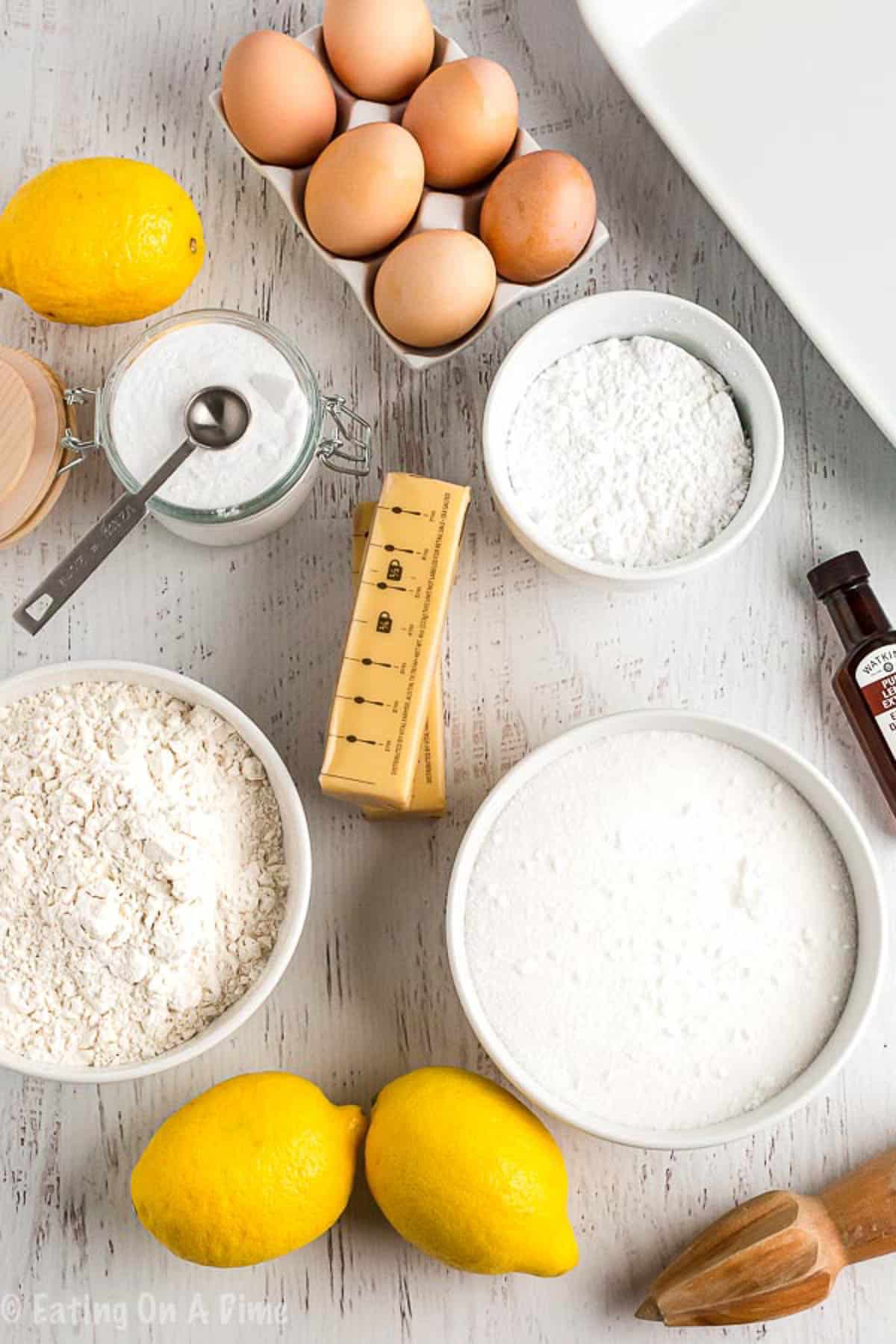 Ingredients for Lemon Bars - Powdered sugar, butter, flour, sugar, eggs, lemon juice, lemon extract, baking powder