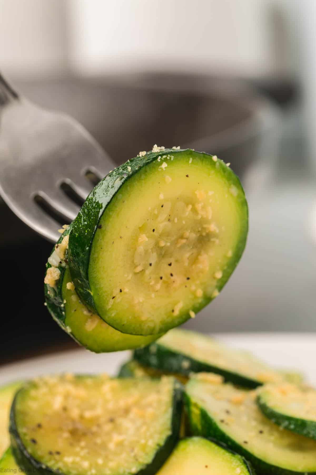 Close up image of slice zucchini on a fork