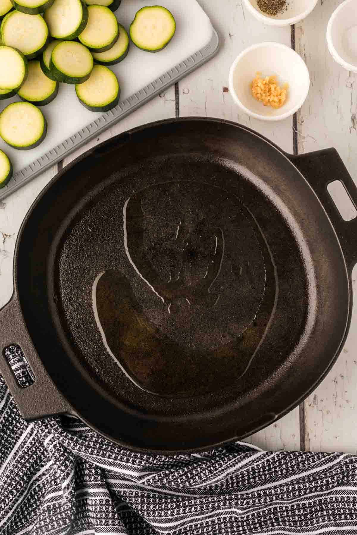 Placing oil in the cast iron skillet