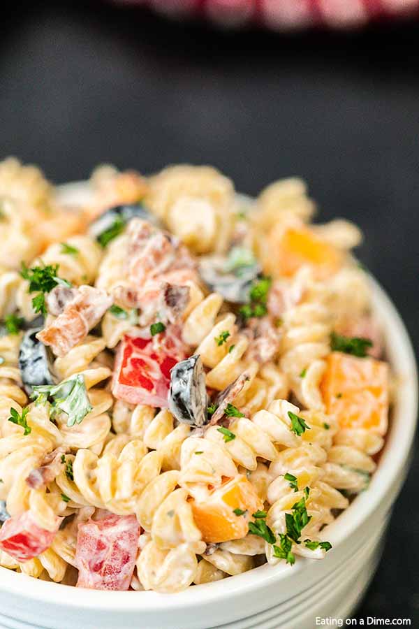 No need to buy the store bought mixes when it is so easy to make this bacon ranch pasta salad recipe. This is delicious with tons of ranch, bacon and more. 