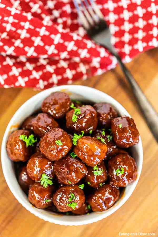 Make these delicious Crock Pot Grape Jelly Meatballs with only 3 ingredients! They are savory and sweet and amazing for game day, parties and much more. 