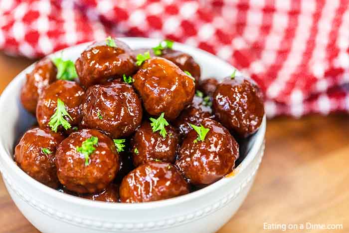 Make these delicious Crock Pot Grape Jelly Meatballs with only 3 ingredients! They are savory and sweet and amazing for game day, parties and much more. 