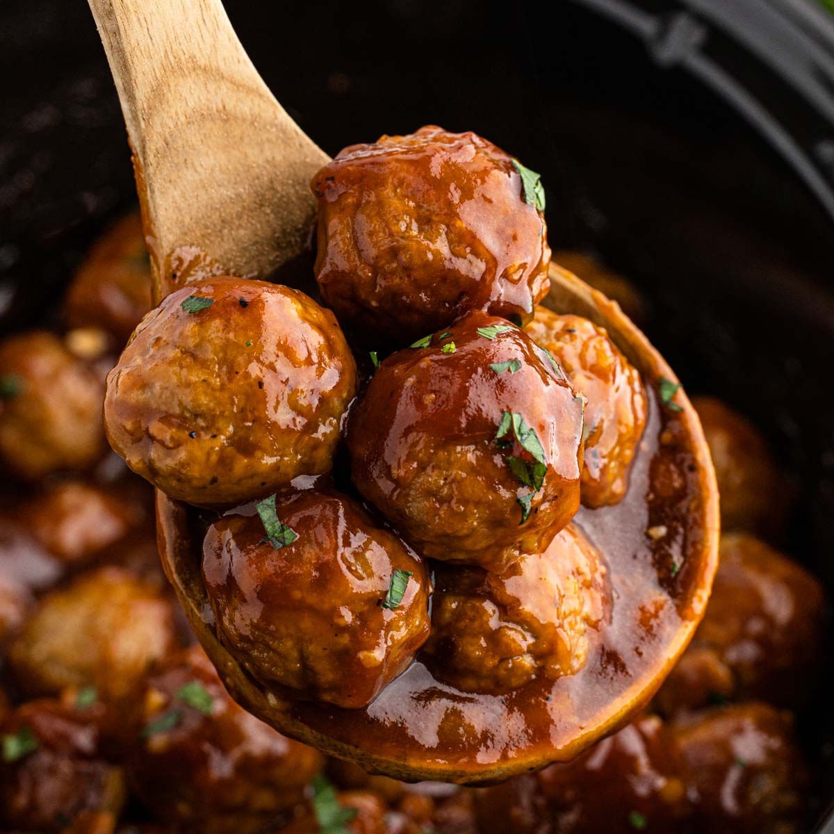 Close up image of BBQ Meatballs on a wooden spoon