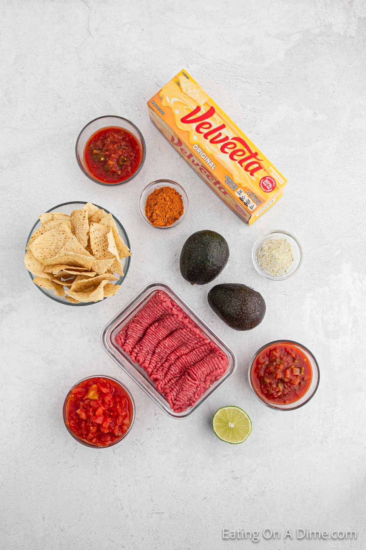 Nacho Bar Ingredients - ground beef, taco seasoning, salsa, velveeta cheese, rotel, avocados, lime, garlic salt, salsa