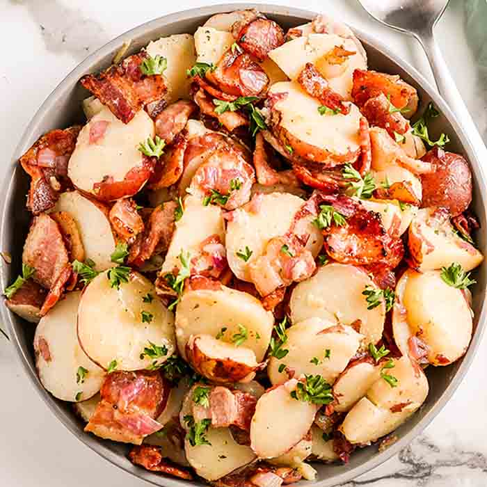 We love German Potato Salad Recipe and the bacon makes it even better. If you prefer a mustard based potato salad, this is the recipe to try. It is amazing.