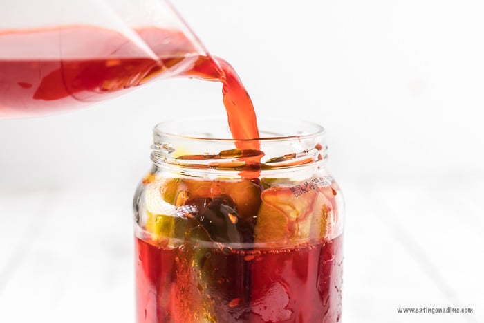 Pouring the Kool Aid in a Jar of Pickles