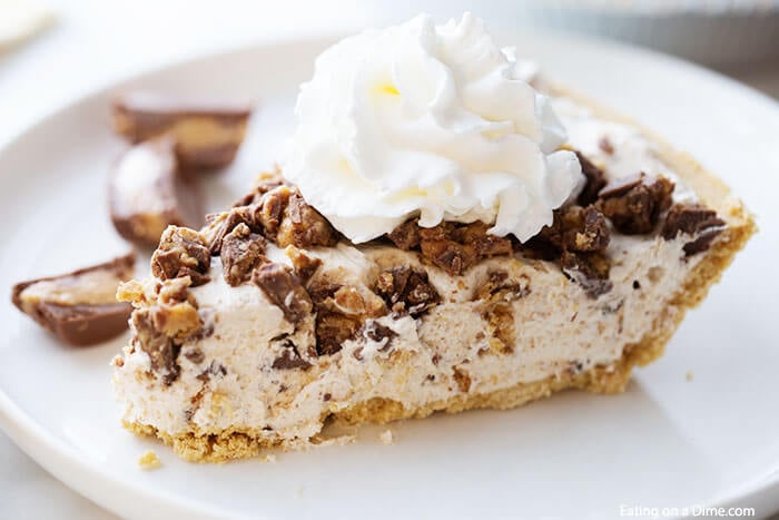 Close up image of Reese's Cup Peanut Butter Pie on a white plate. 