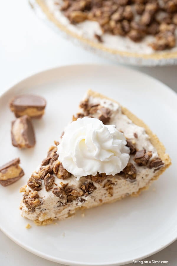 Close up image of a piece of Reese's peanut Butter pie on a white plate.