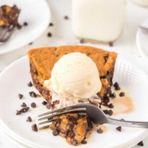 Skillet chocolate chip cookie recipe melts in your mouth with ooey gooey decadent chocolate. Top with vanilla ice cream for a delicious treat. 