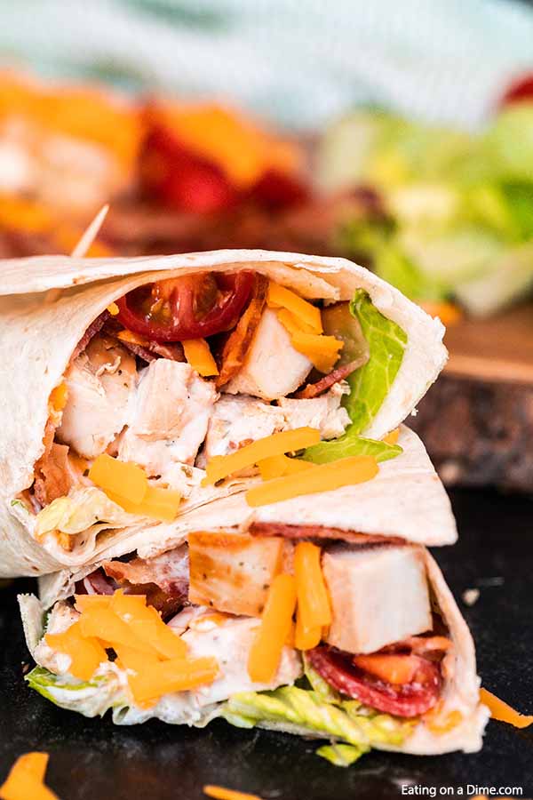 Bacon ranch chicken wrap has everything you need for a delicious and healthy meal. Ranch and bacon fans will go crazy over these chicken wraps and it's ready in minutes! Try making bacon ranch chicken wrap with tortillas for the best lunch ideas and so easy. #eatingonadime #baconranchchickenwrap 