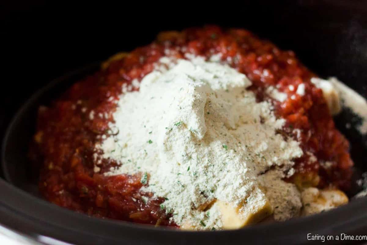 All the ingredients added to a crock pot.  