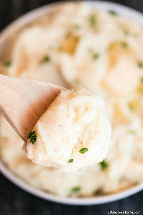 Make Crock Pot Mashed Potatoes Recipe to feed a crowd. This easy make ahead way to make mashed potatoes is perfect for holiday cooking and so delicious and creamy. Try this slow cooker recipe for Thanksgiving for the best mashed potatoes. #eatingonadime #crockpotmashedpotatoesrecipe