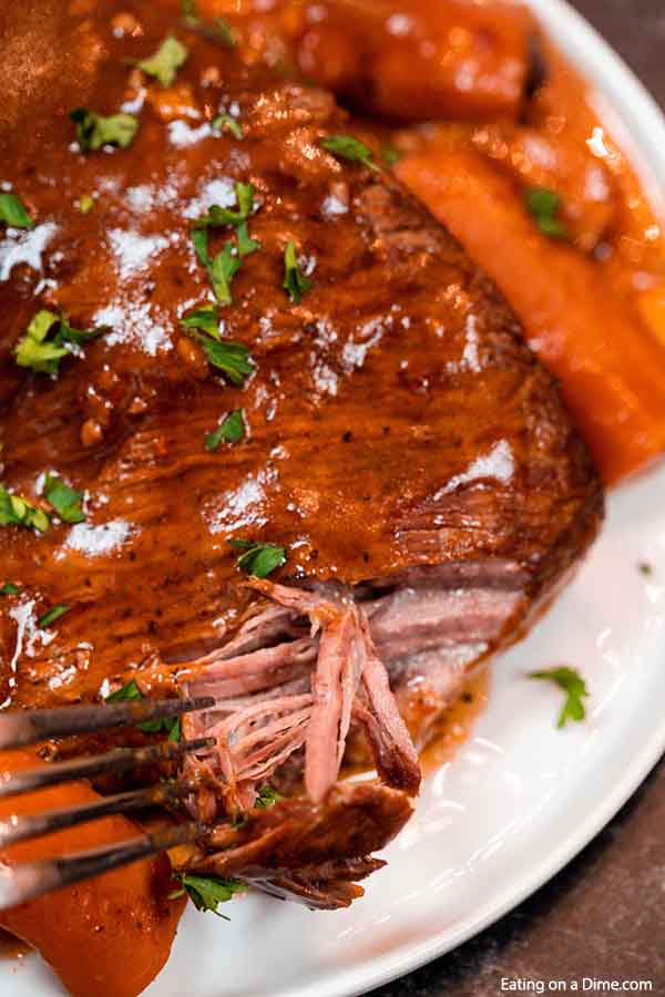 Slow cooker red wine brisket crock pot recipe is easy to make and so tender and delicious. Lots of veggies and a delicious broth make red wine brisket recipes a tasty dinner idea. Red wine brisket slow cooker recipe is so flavorful. Try red wine brisket. #eatingonadime #slowcookerredwinebeefbrisketrecipe