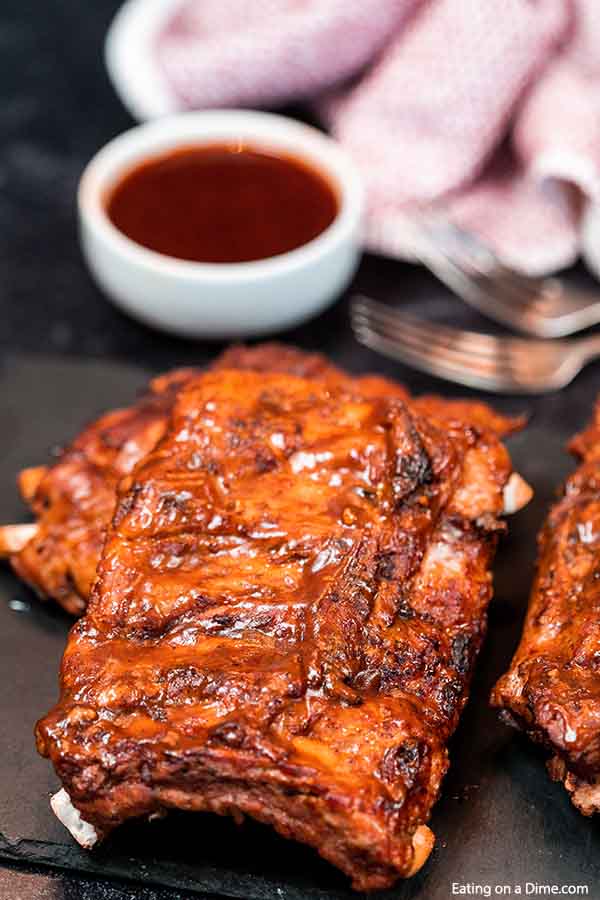 Crock Pot Dr Pepper Ribs has the perfect amount of flavor and the meat is tender from being slow cooked all day. You won't believe how easy this crock pot dr pepper ribs recipe is. The combination of dr. pepper and BBQ sauce in the slow cooker with ribs makes this a delicious dinner idea. Ribs with dr pepper crock pot recipe makes dinner so easy. #eatingonadime #crockpotdrpepperribs