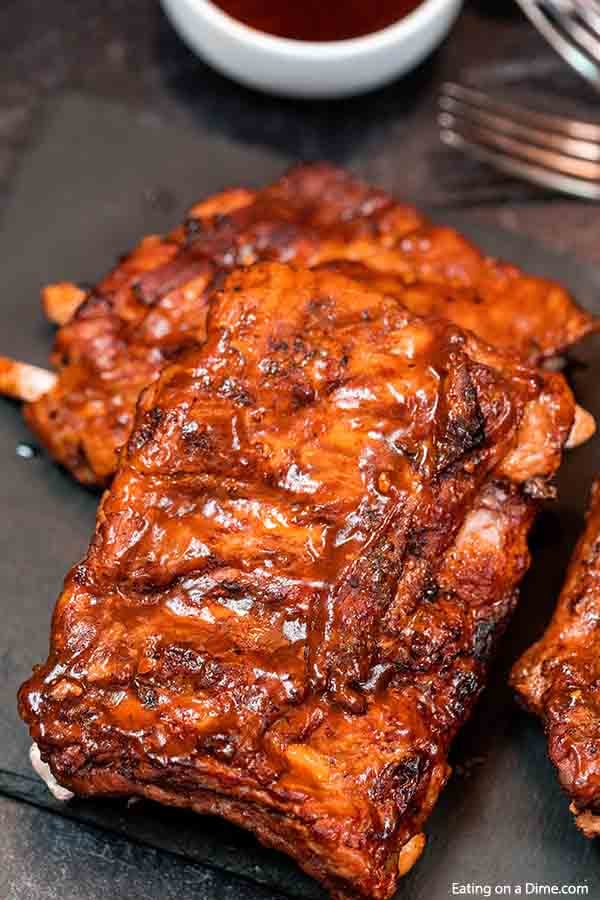Crock Pot Dr Pepper Ribs has the perfect amount of flavor and the meat is tender from being slow cooked all day. You won't believe how easy this crock pot dr pepper ribs recipe is. The combination of dr. pepper and BBQ sauce in the slow cooker with ribs makes this a delicious dinner idea. Ribs with dr pepper crock pot recipe makes dinner so easy. #eatingonadime #crockpotdrpepperribs Crock Pot Dr Pepper Ribs has the perfect amount of flavor and the meat is tender from being slow cooked all day. You won't believe how easy this crock pot dr pepper ribs recipe is. The combination of dr. pepper and BBQ sauce in the slow cooker with ribs makes this a delicious dinner idea. Ribs with dr pepper crock pot recipe makes dinner so easy. #eatingonadime #crockpotdrpepperribs
