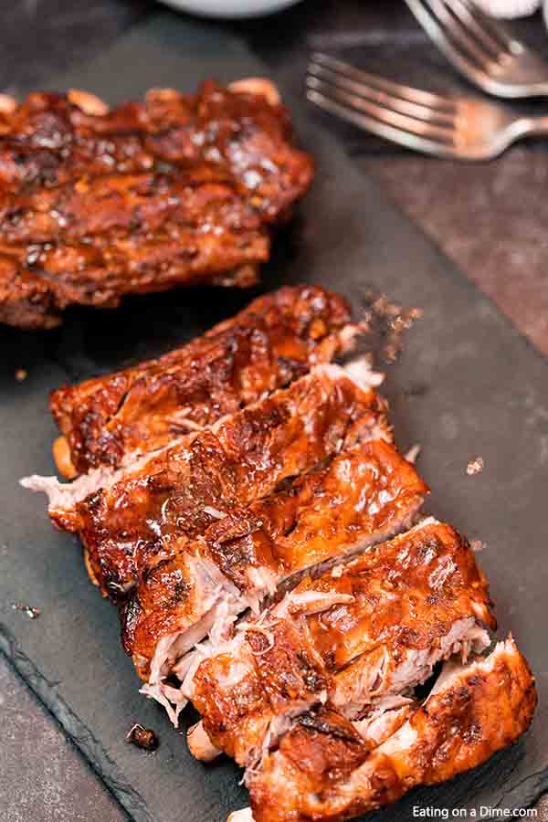 Crock Pot Dr Pepper Ribs has the perfect amount of flavor and the meat is tender from being slow cooked all day. You won't believe how easy this crock pot dr pepper ribs recipe is. The combination of dr. pepper and BBQ sauce in the slow cooker with ribs makes this a delicious dinner idea. Ribs with dr pepper crock pot recipe makes dinner so easy. #eatingonadime #crockpotdrpepperribs