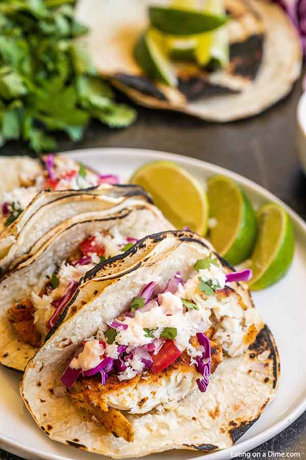 Easy fish tacos recipe is a simple meal idea full of flavor anytime you are craving tacos. Fish tacos are super fast and a healthy dinner for Taco Tuesday. Everyone will love the sauce on easy fish tacos tilapia. Save money with this easy fish tacos simple recipe. .#eatingonadime #easyfishtacos