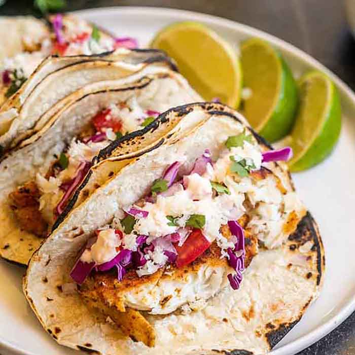 Easy fish tacos recipe is a simple meal idea full of flavor anytime you are craving tacos. Fish tacos are super fast and a healthy dinner for Taco Tuesday. Everyone will love the sauce on easy fish tacos tilapia. Save money with this easy fish tacos simple recipe. .#eatingonadime #easyfishtacos