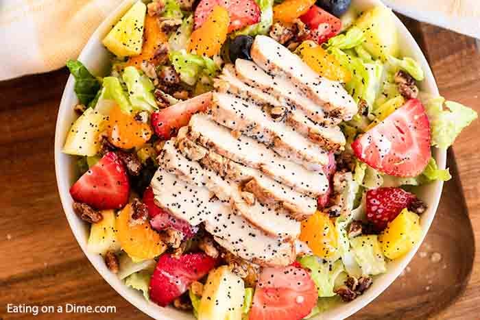 Grilled Chicken on top os a Strawberry Poppyseed Salad