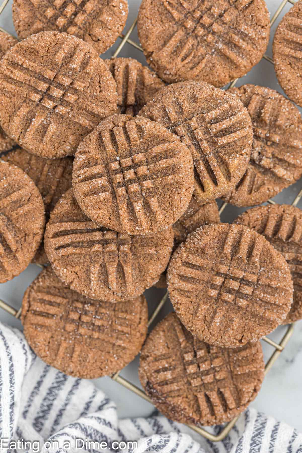 Chocolate Peanut Butter Cookies stacked on a wire rack