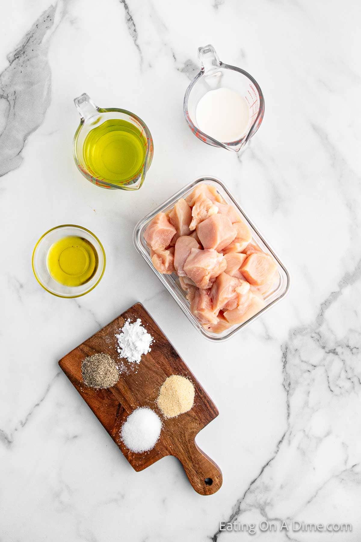 Grilled chicken nuggets ingredients - chicken breast, pickle juice, milk, powdered sugar, salt, pepper, garlic powder, olive oil