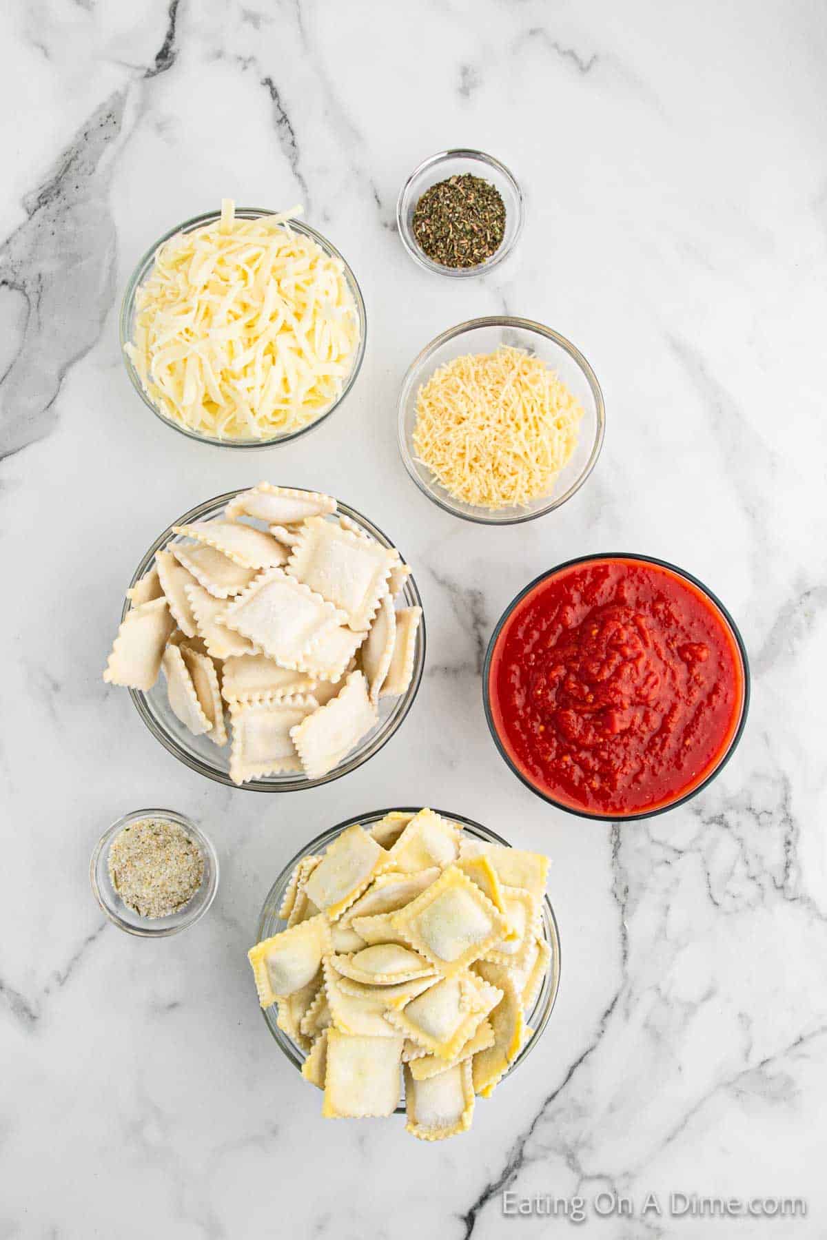 Baked Ravioli Ingredients - crushed tomatoes, Italian Seasoning, garlic salt, parmesan cheese, raviolis