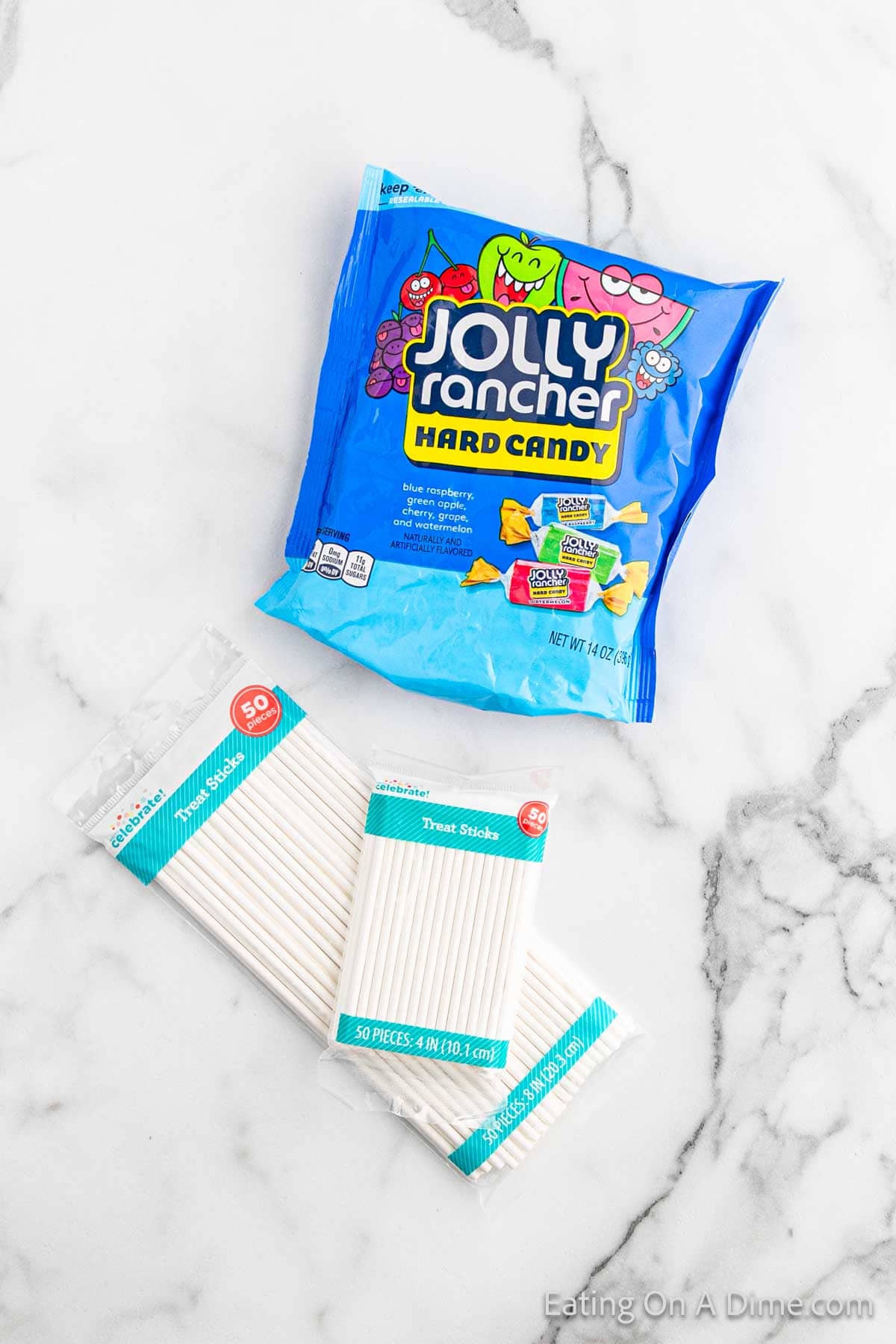 Jolly Ranch Suckers ingredients - jolly rancher candy, lollipop sticks, parchment paper, sucker wrappers