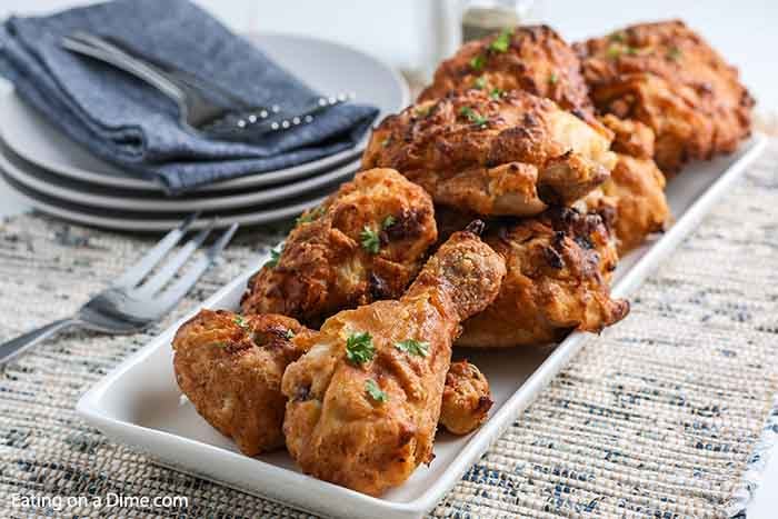 Air Fryer Fried Chicken is a game changer. Enjoy crispy fried chicken without all of the work or fat. It's delicious and really simple. Try making drumsticks, wings, thighs or anything you prefer. This recipe is super easy and the best flavor with buttermilk. #eatingonadime #airfryerfriedchicken